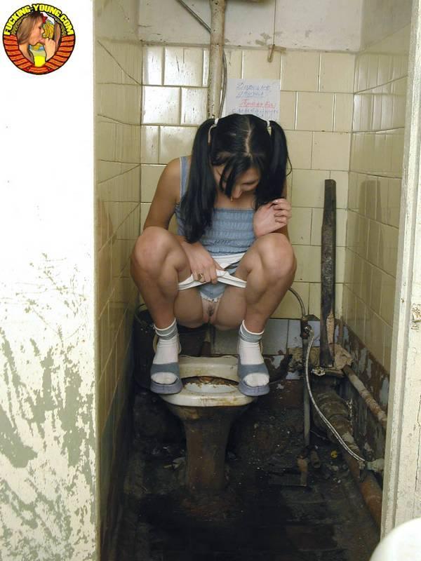 Teen girl in pigtails squats for a pee on the filthiest toilet know to mankind(9)