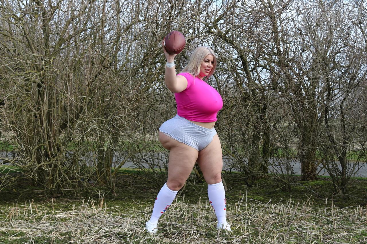 Curvaceous football player Natasha Crown flaunts her huge ass outdoors(1)