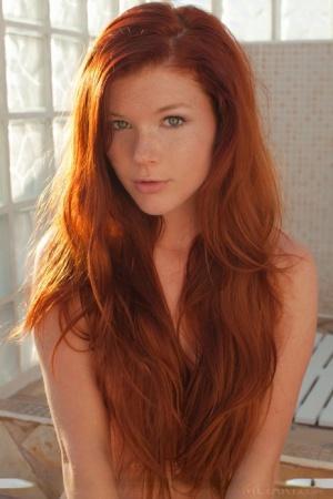 Redhead babe Mia Sollis revealing small teen tits and tight ass outdoors