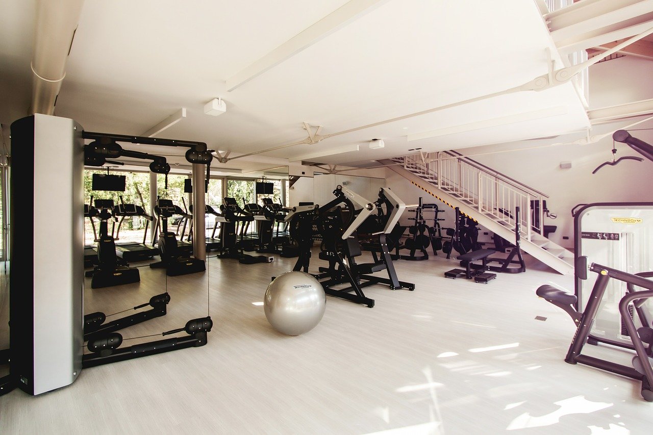 Indoor gym with lots of sports equipment