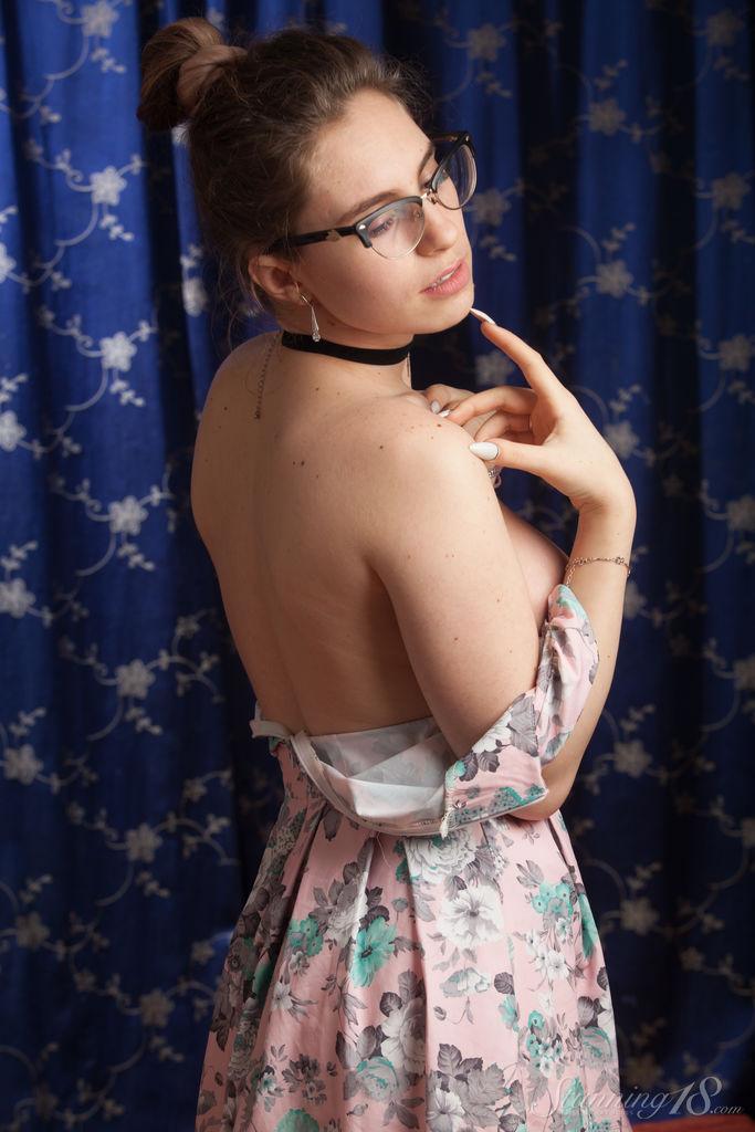 Nerdy 18 year old Liza Loo holds a rose showing her firm breasts in glasses(7)