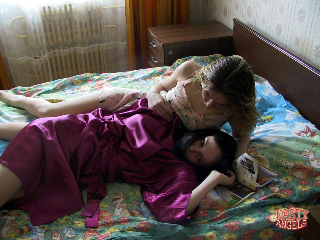 Naughty amateur teens Alina & Marina cuddle in bed after taking a shower(2)