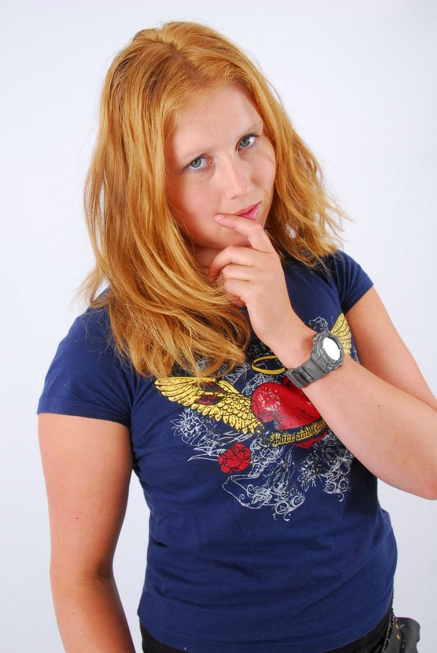 Natural redhead Judy displays her grey G-Shock watch in a T-shirt and jeans(15)