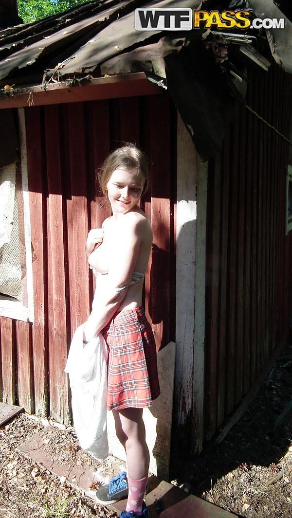 Solo girl shows her tits and twat while forcing entry into abandoned cabin(2)