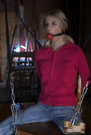 Man uses chains, shackles, and red gag to punish sexy Mia Hilton