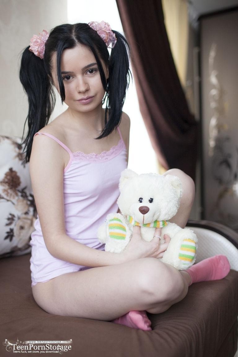 Cute teen Rozie shows her tight slit after putting down her plush toy(3)