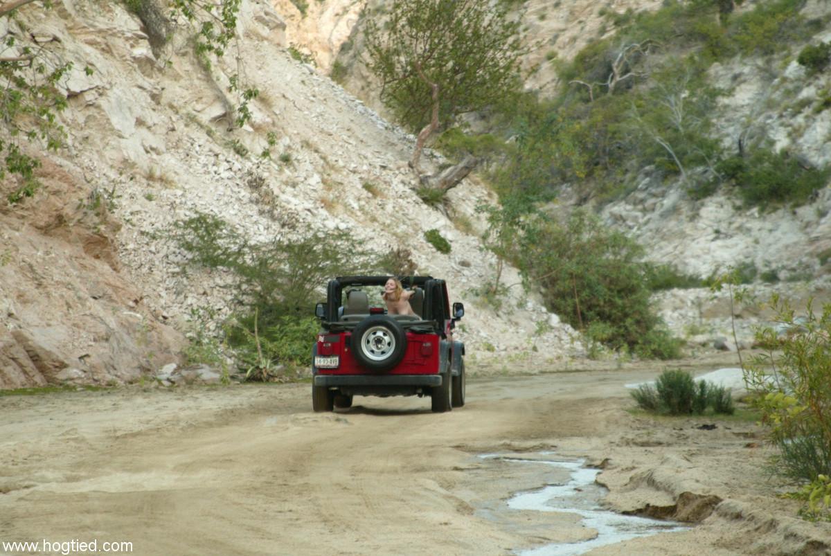 Naked MILF Dee Williams endures a rough offroad ride while standing in bondage(7)