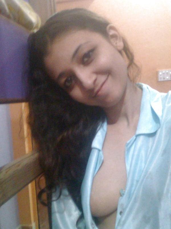 Indian solo girl holds her face firm while letting nipples free of lingerie(6)