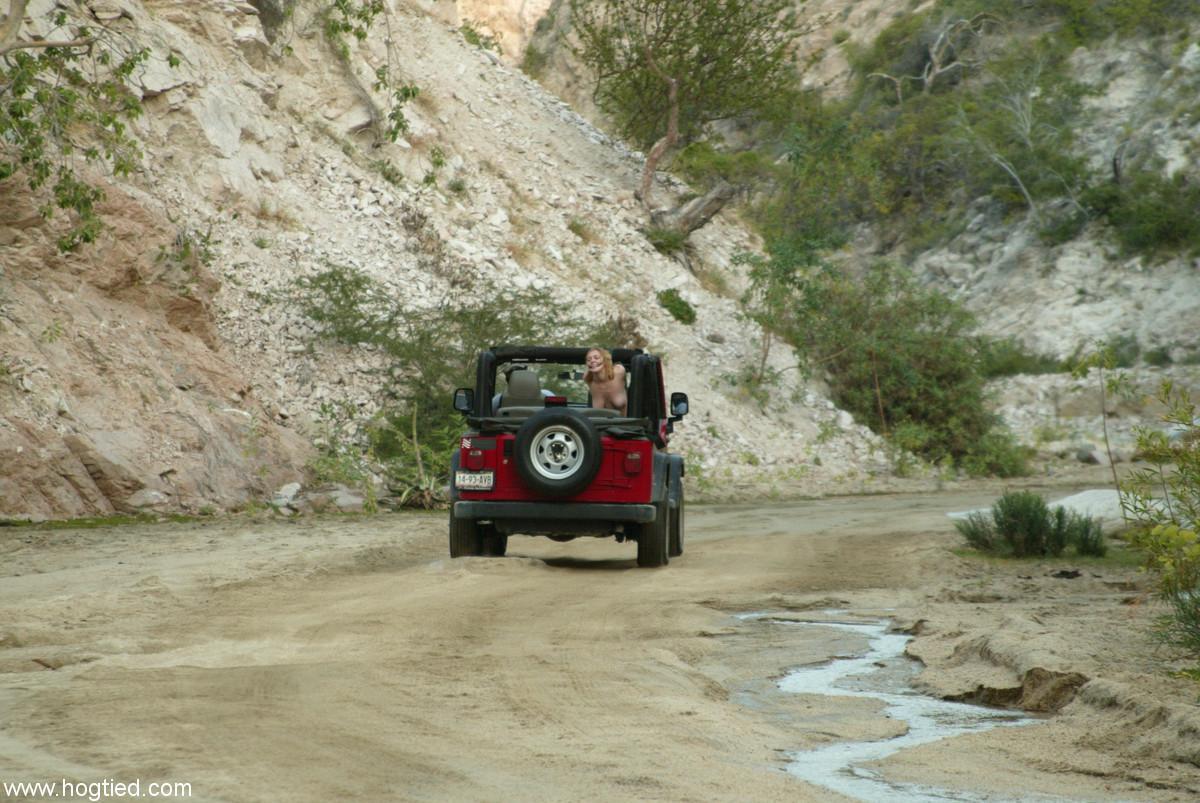 Naked MILF Dee Williams endures a rough offroad ride while standing in bondage(6)