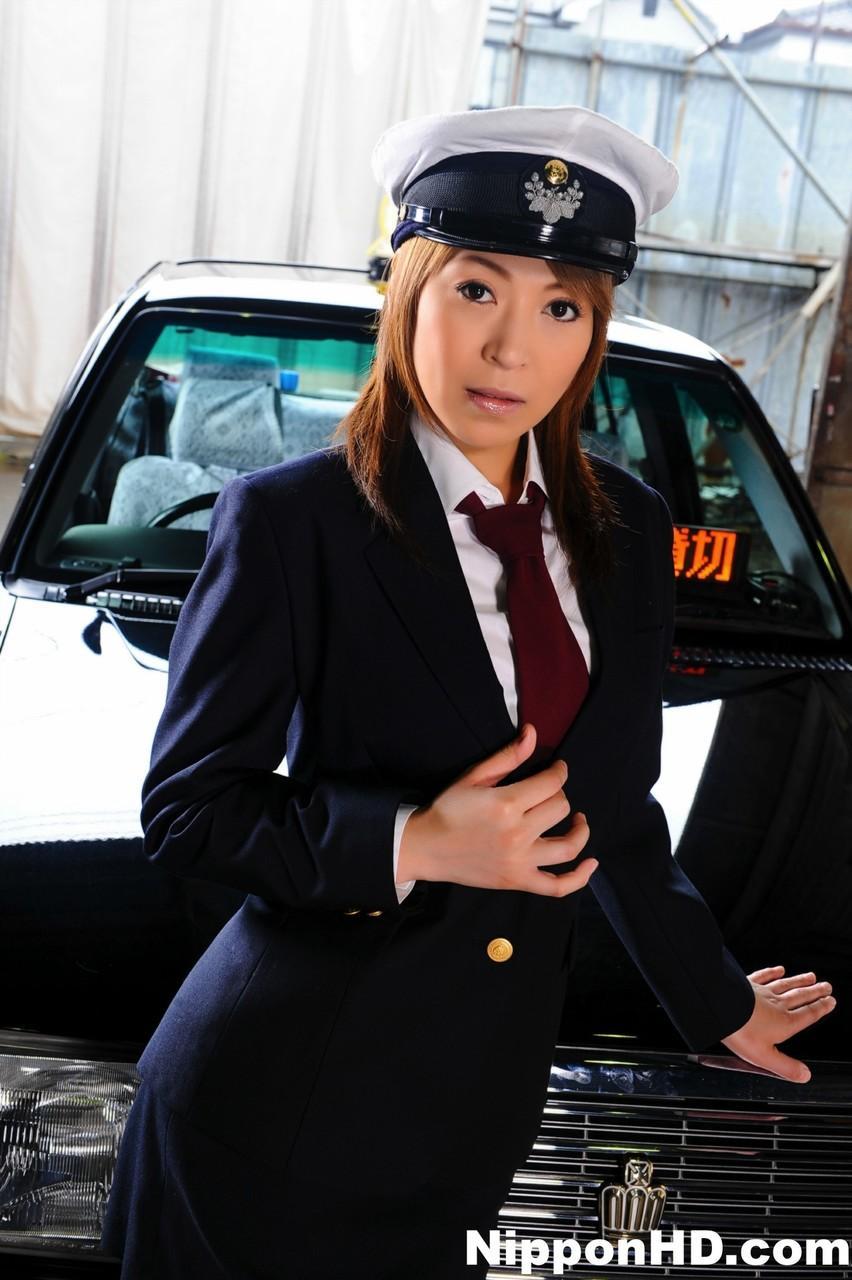 Female Japanese taxi driver unbuttons her blouse during upskirt action(2)