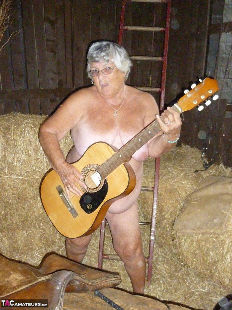 Fat oma Grandma Libby gets naked in a barn while playing acoustic guitar(19)