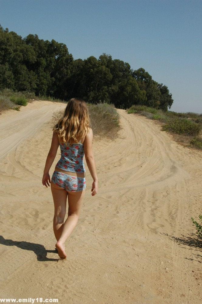 Sweet young girl exposes her butt crack while alone on a dirt road(1)