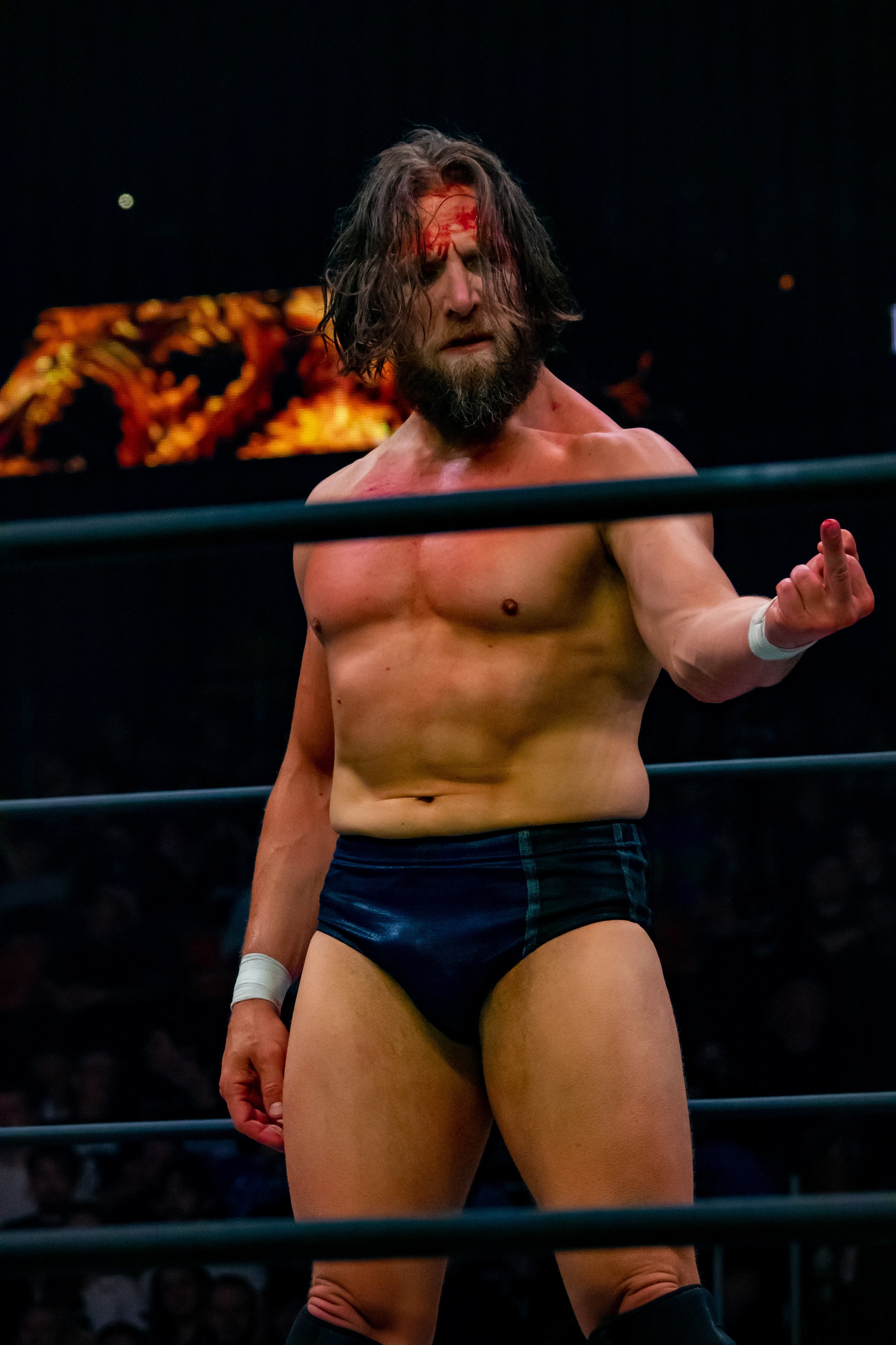 bryan danielson bleeding and pointing his middle finger
