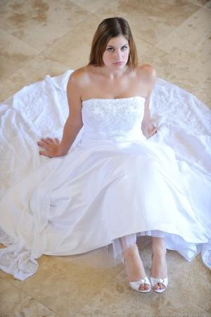 Busty glamorous amateur Danielle models wedding gown indoors & by the pool