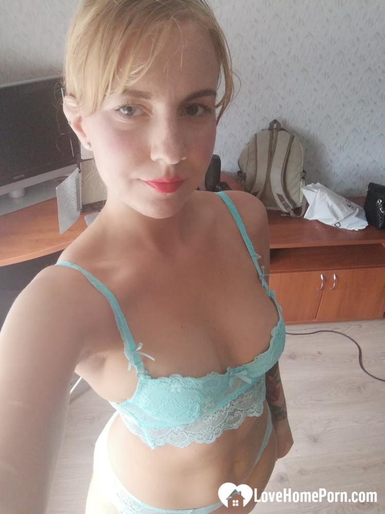 Beautiful amateur doll takes selfies while posing in her turquoise lingerie(3)