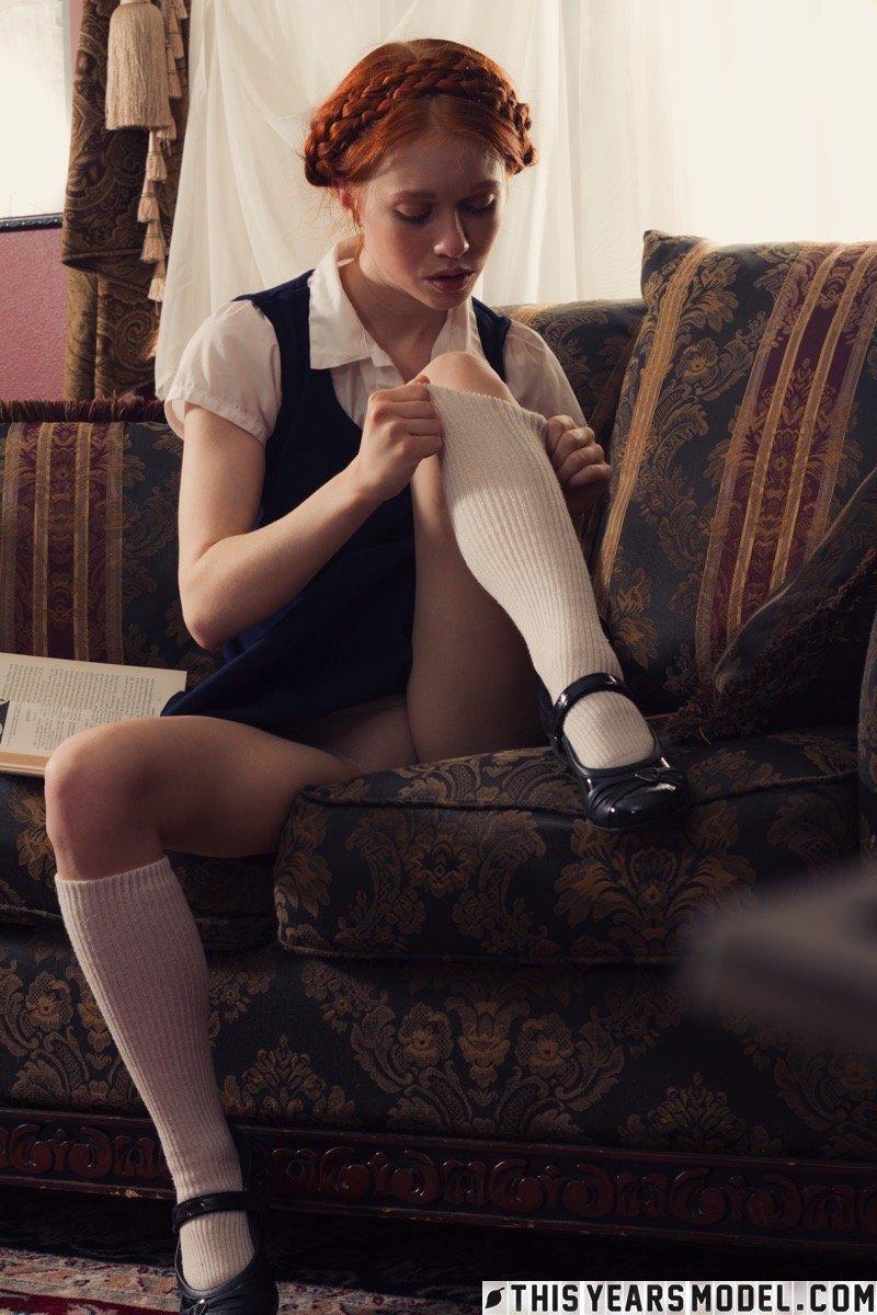 Young looking redhead Dolly Little gets naked in white socks and Mary Jane's(4)