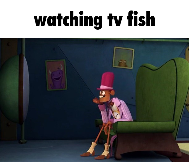 an image of gizmo with the text 'watching tv fish'
