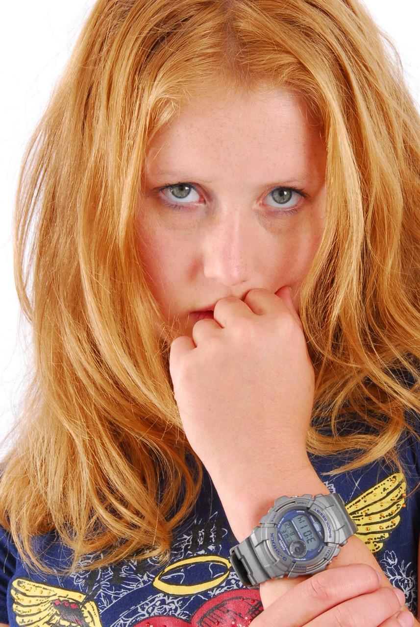 Natural redhead Judy displays her grey G-Shock watch in a T-shirt and jeans(16)