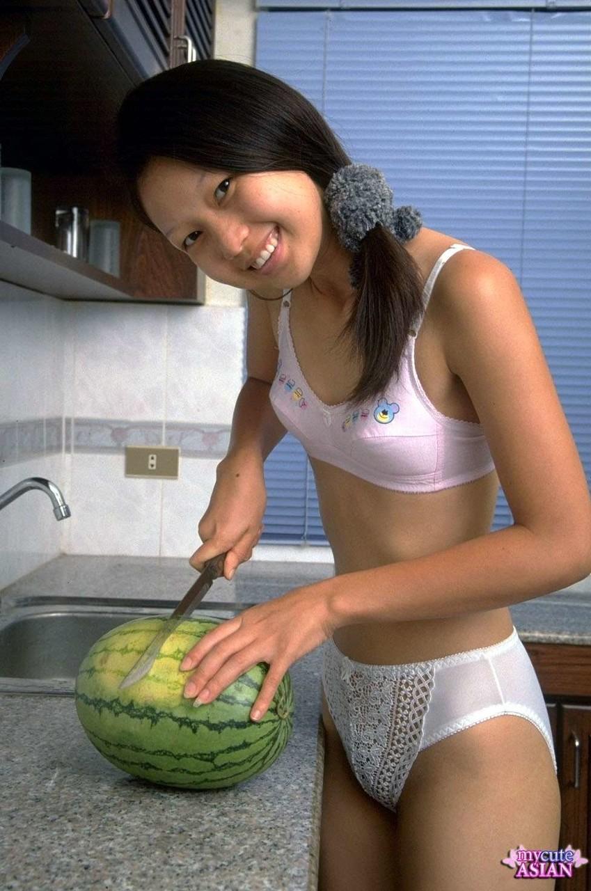 Charming Asian teen removes lace underwear while eating a watermelon(1)