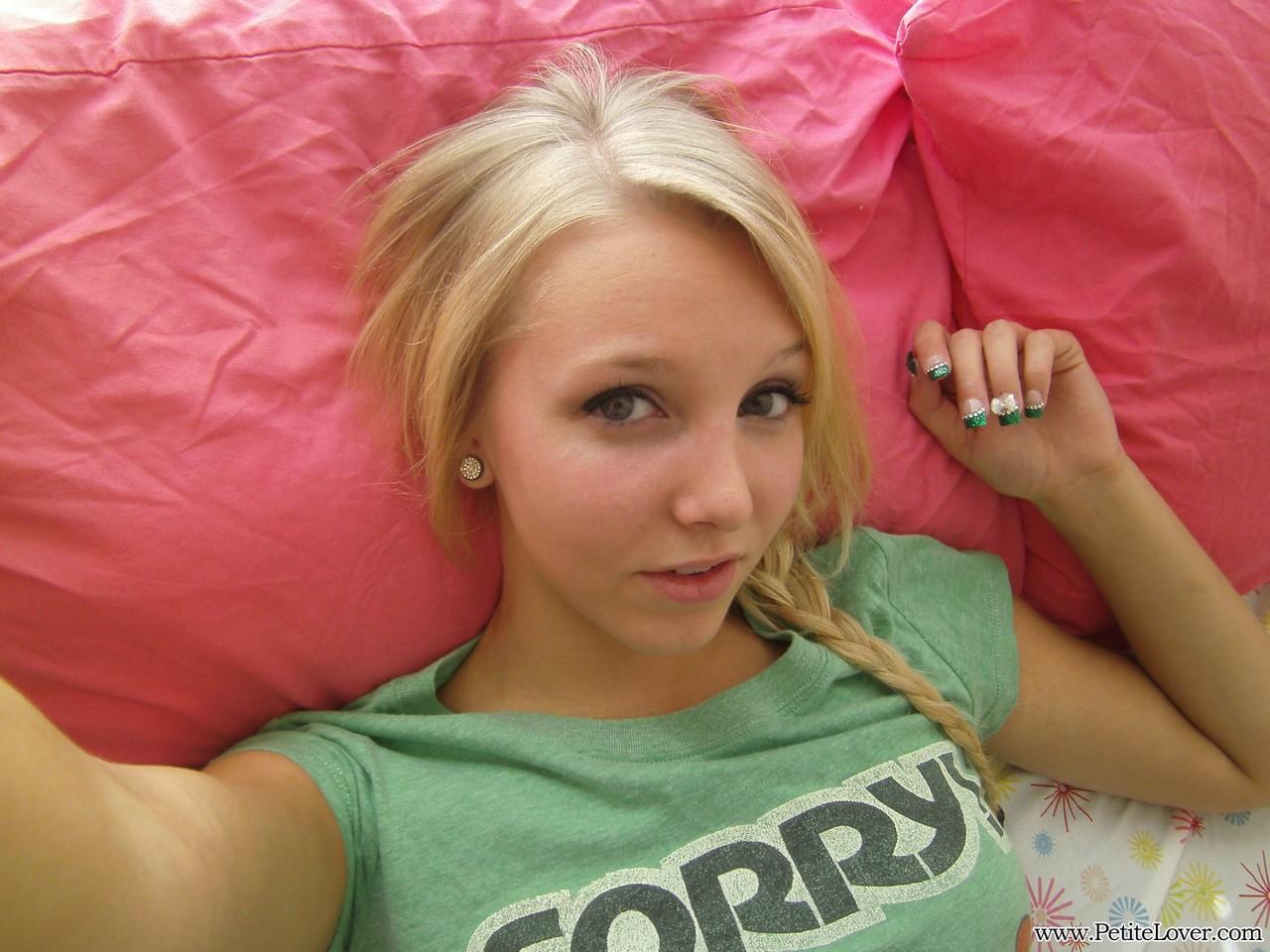 Cute blonde teen snaps self shots of her bare boobs in cutoff jean shorts(3)