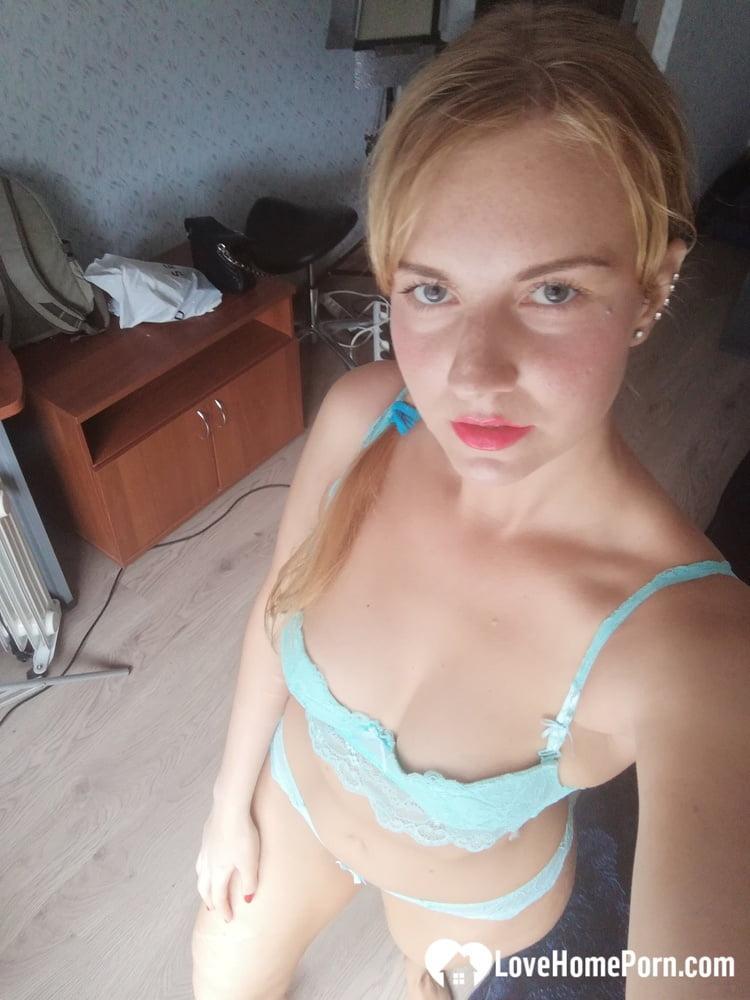 Beautiful amateur doll takes selfies while posing in her turquoise lingerie(4)