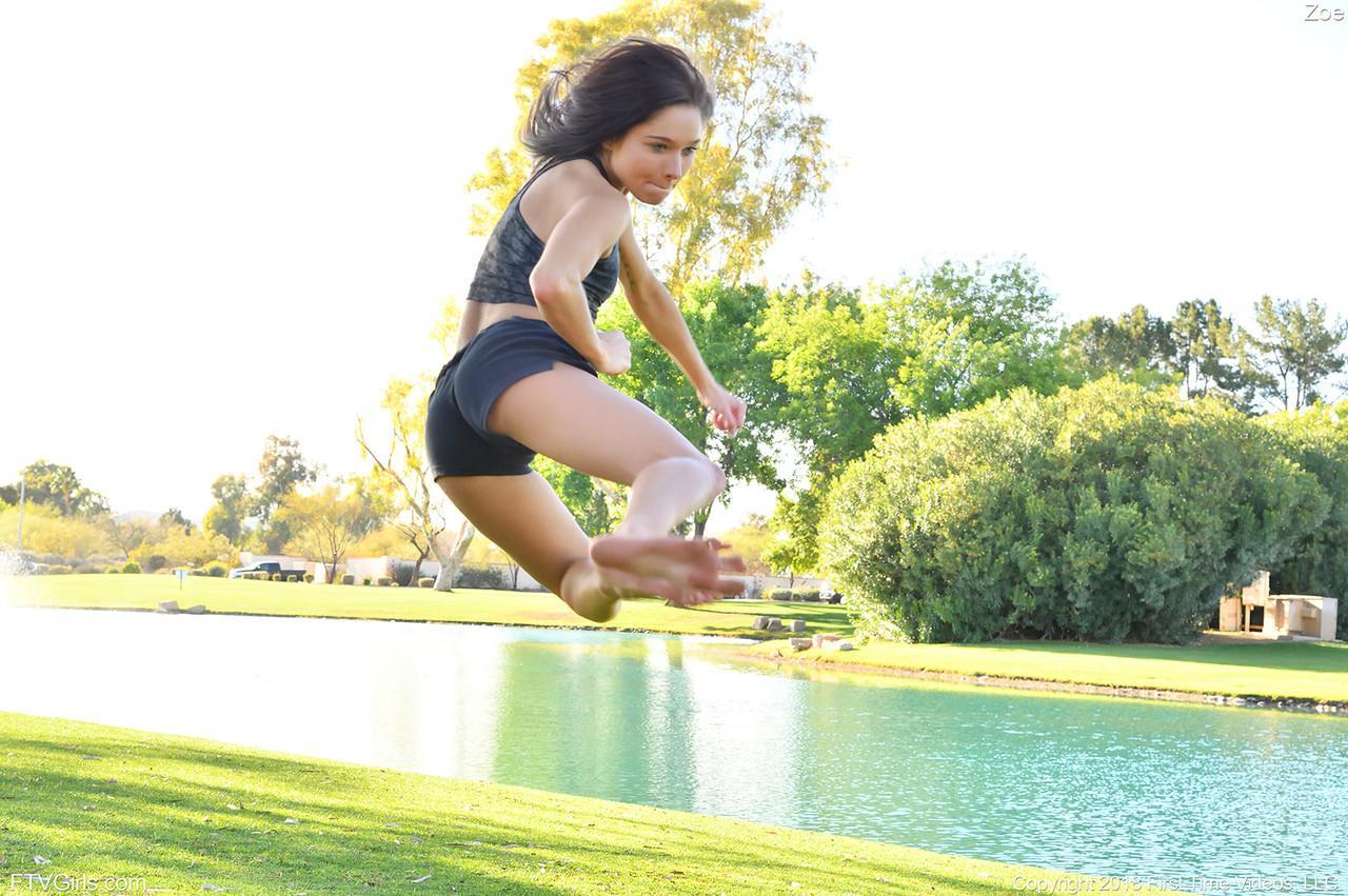 Teenage hottie in sexy outfit Zoe doing exercise outdoors by the water(8)