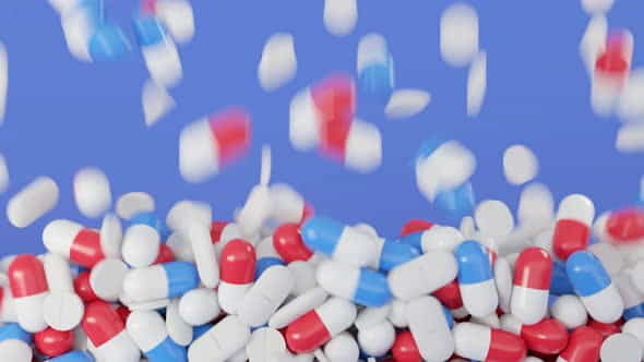 Colorful pills fall on isolated - VideoHive 33580312