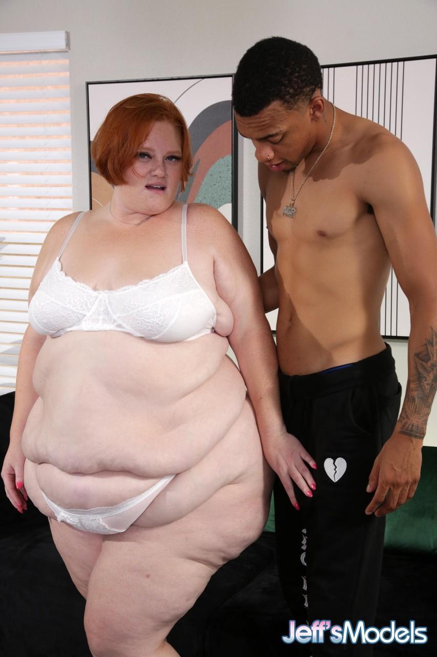 Redheaded BBW Julie Ginger	gets fucked doggystyle by a skinny black guy(4)