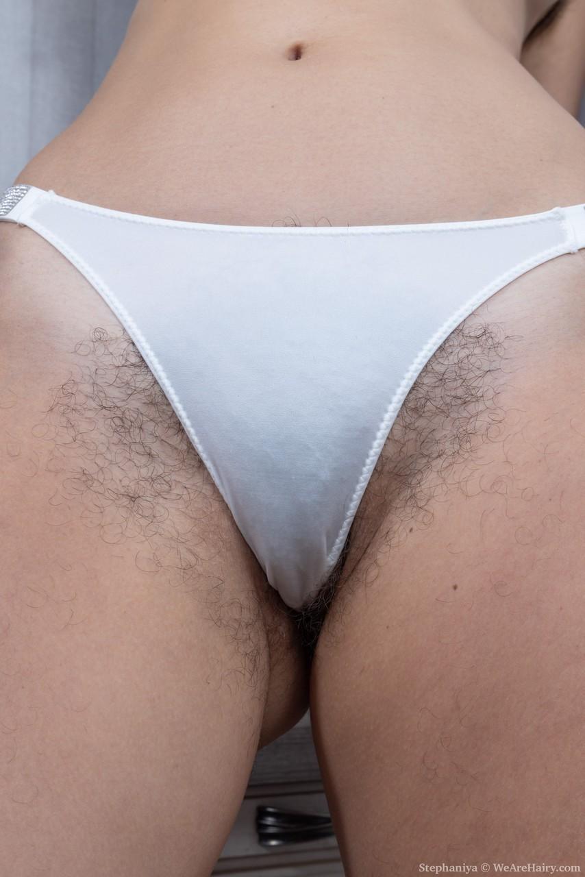 Tall brunette Stephaniya strips her dress & panties to show her hairy twat(8)