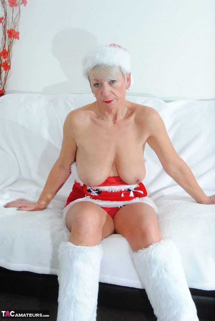 Brazen horny granny Shazzy B hangs her big saggy boobs out by the Xmas tree(4)