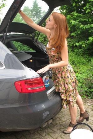 Redheaded German Meine Fotze strips and masturbates in the car in public