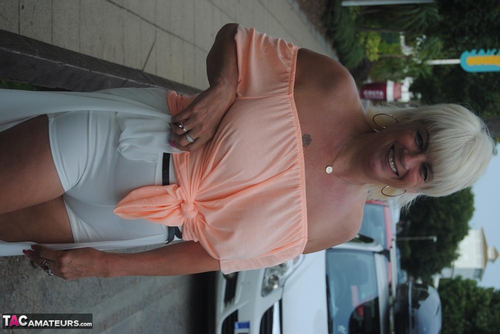 Mature British woman Denise Davies likes flashing her saggy tits in public(12)