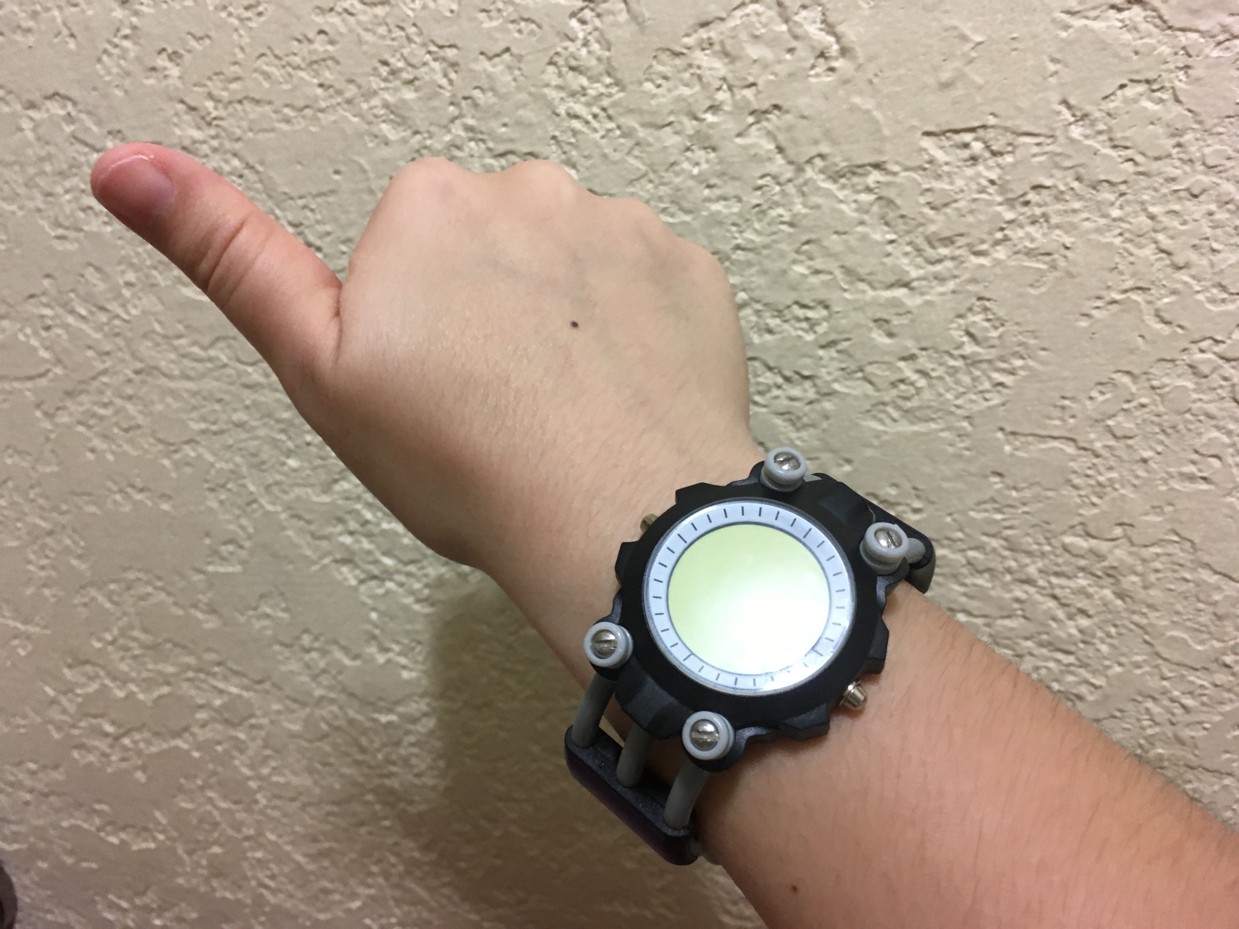 Photo of someone wearing one of the promotional VLR watches while giving a thumbs up