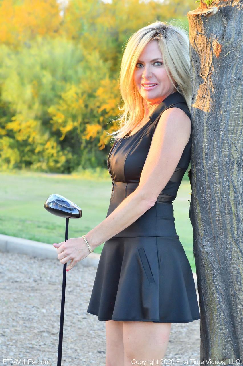 Seductress Hilary flashes her panties & shows her cleavage while playing golf(19)