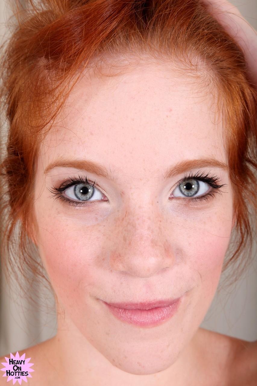 Attractive redhead with freckles Roxy Rush reveals her body on a couch(17)