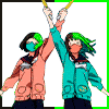 Two idol fans holding up their glowsticks.