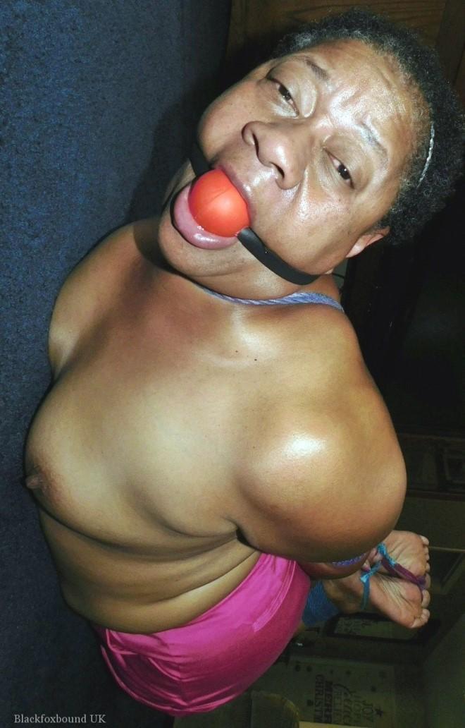 Overweight black woman Trixie struggles against a ball gag while hogtied(13)